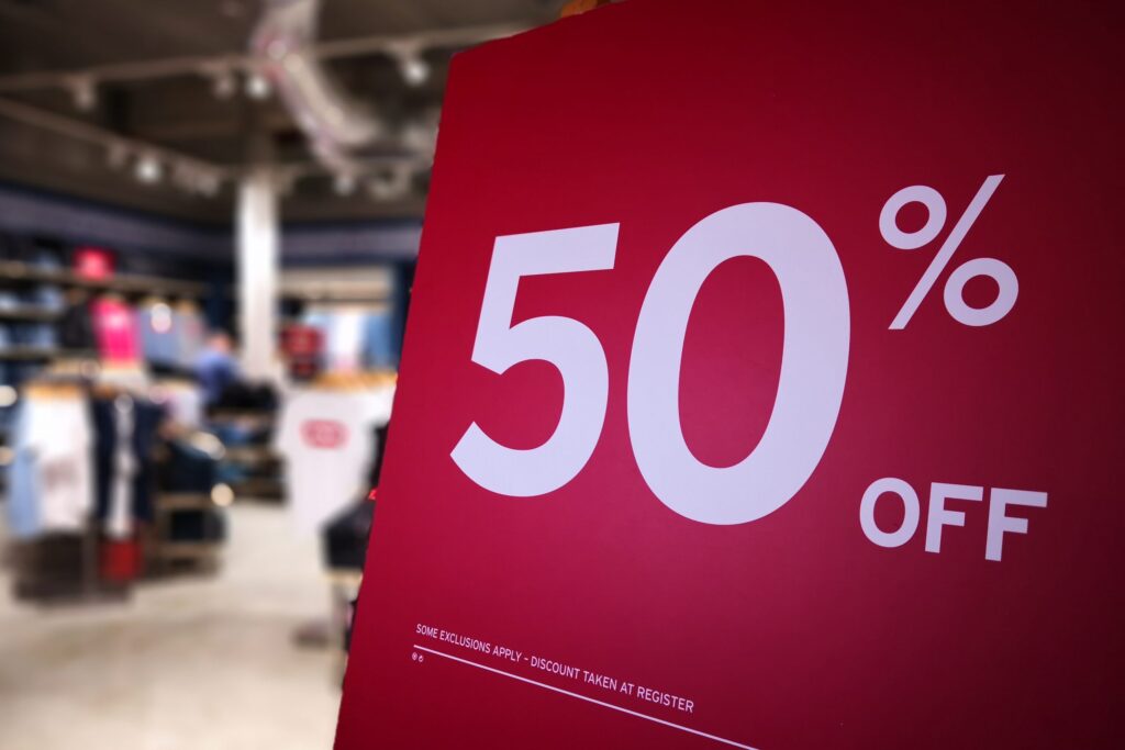 50 discount sign on display board in a fashion store